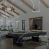 a clubhouse with billiards and soft couch and chair seating
