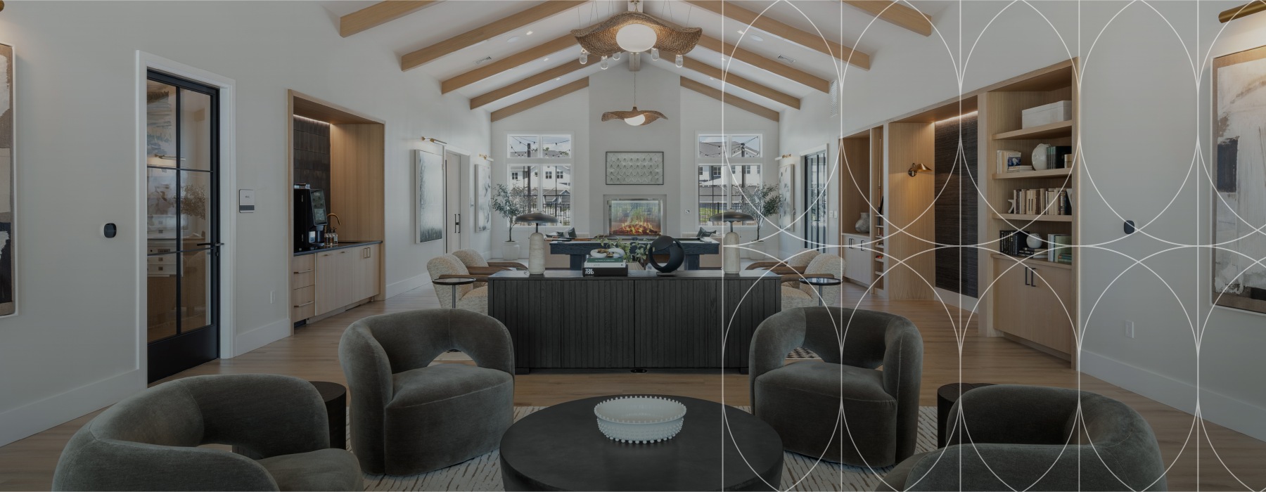 Resident lounge at Alta Oak and Pine apartments in Londonderry, NH, featuring a geometric overlay design.