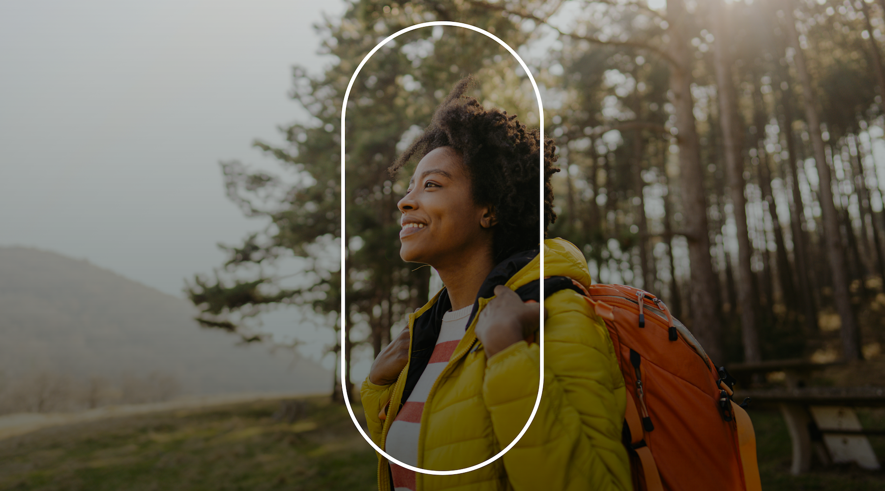 girl with backpack near trees