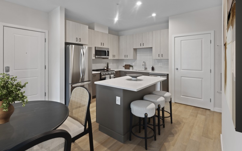 a kitchen with a table and chairs