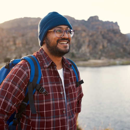 guy smiling by lake
